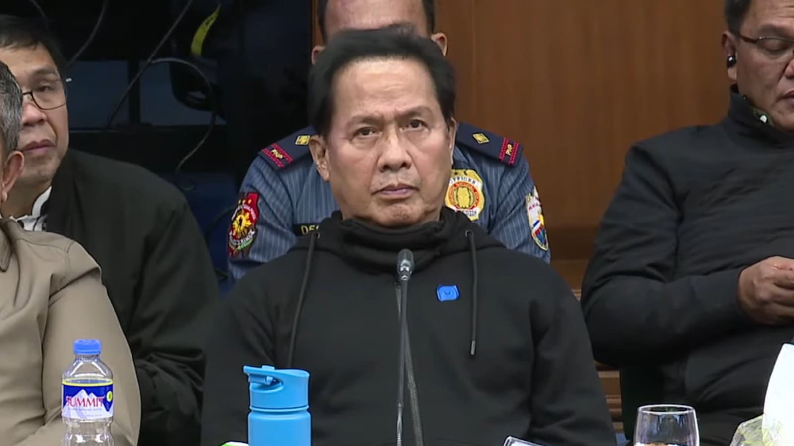 Apollo Quiboloy in black jacket seated in the Senate