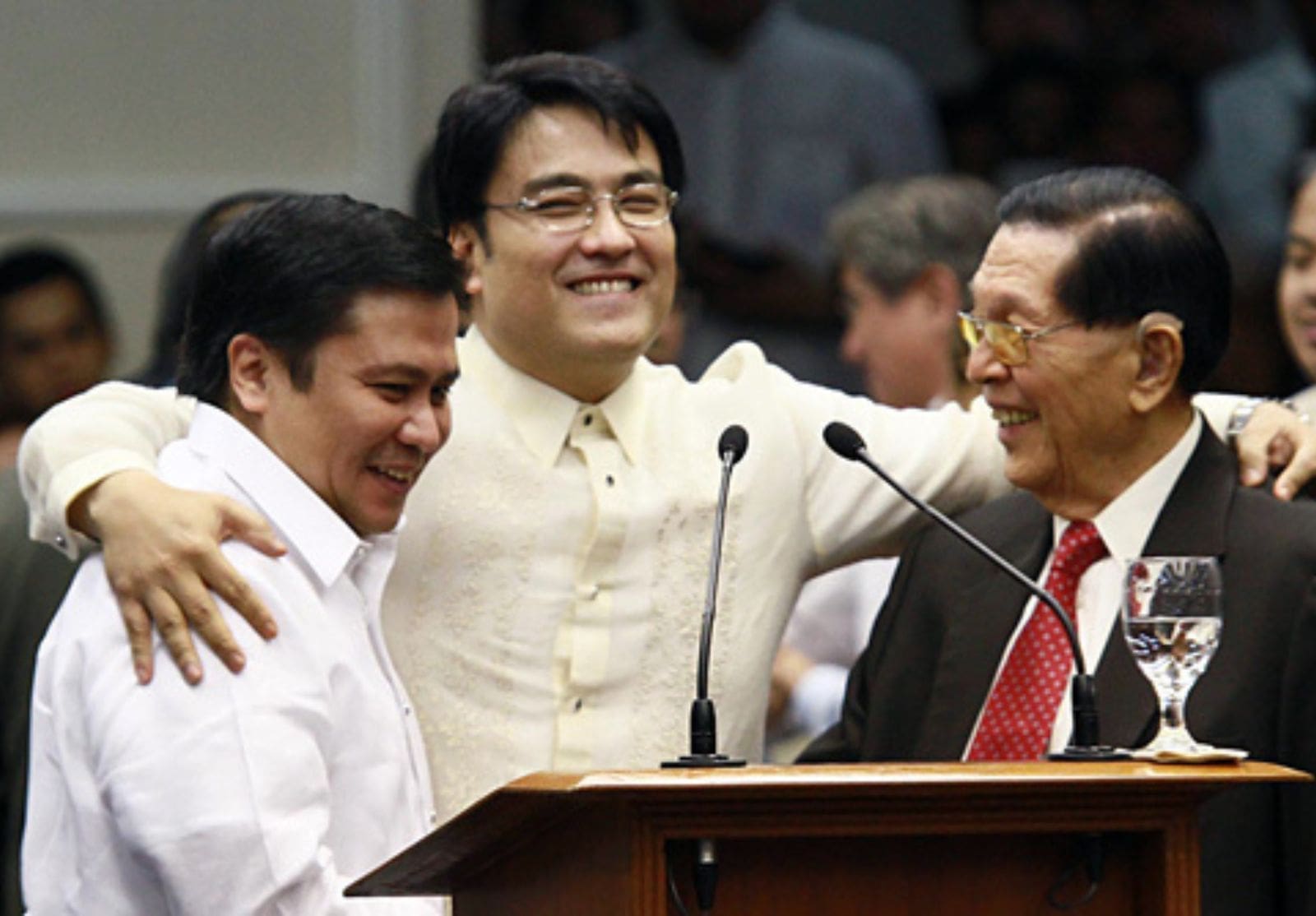 Estrada, Revilla, and Enrile embracing