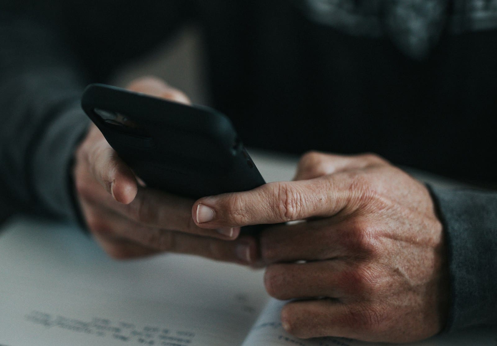 old man holding a phone nathan-dumlao-y440_q4e-0E-unsplash